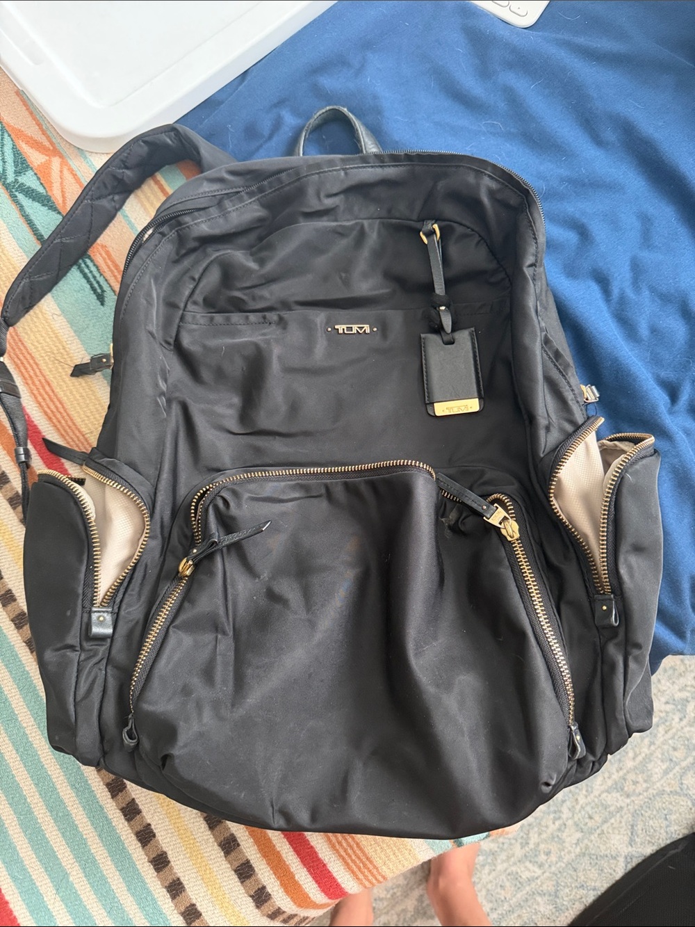 Tumi Black Nylon Backpack with Gold Accents and Tan Interior Trim